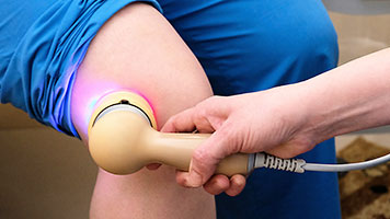 patient getting cold laser therapy in Sacramento, CA